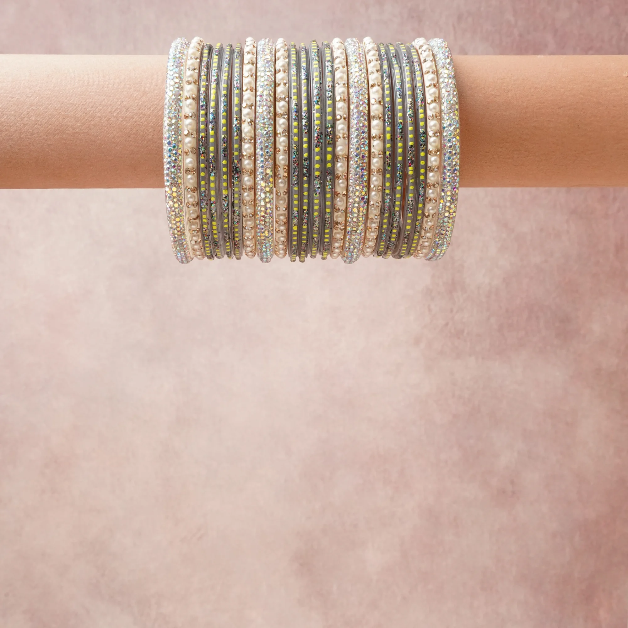 A grounding Off-White forms the heart of the set, while touches of Iridescent Clear, Lime Green add charm.

A thoughtful composition of Metal Alloy, Simulated Pearl, Crystal Rhinestone, Resin / Enamel, designed to feel complete without being heavy.
Each element layers seamlessly, creating a look that is refined, wearable and quietly striking.